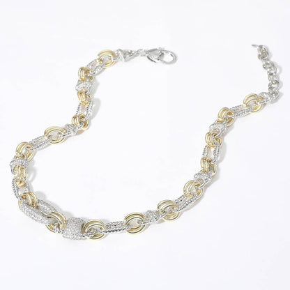 Two-tone silver and gold necklace with CZ accents on a white background.