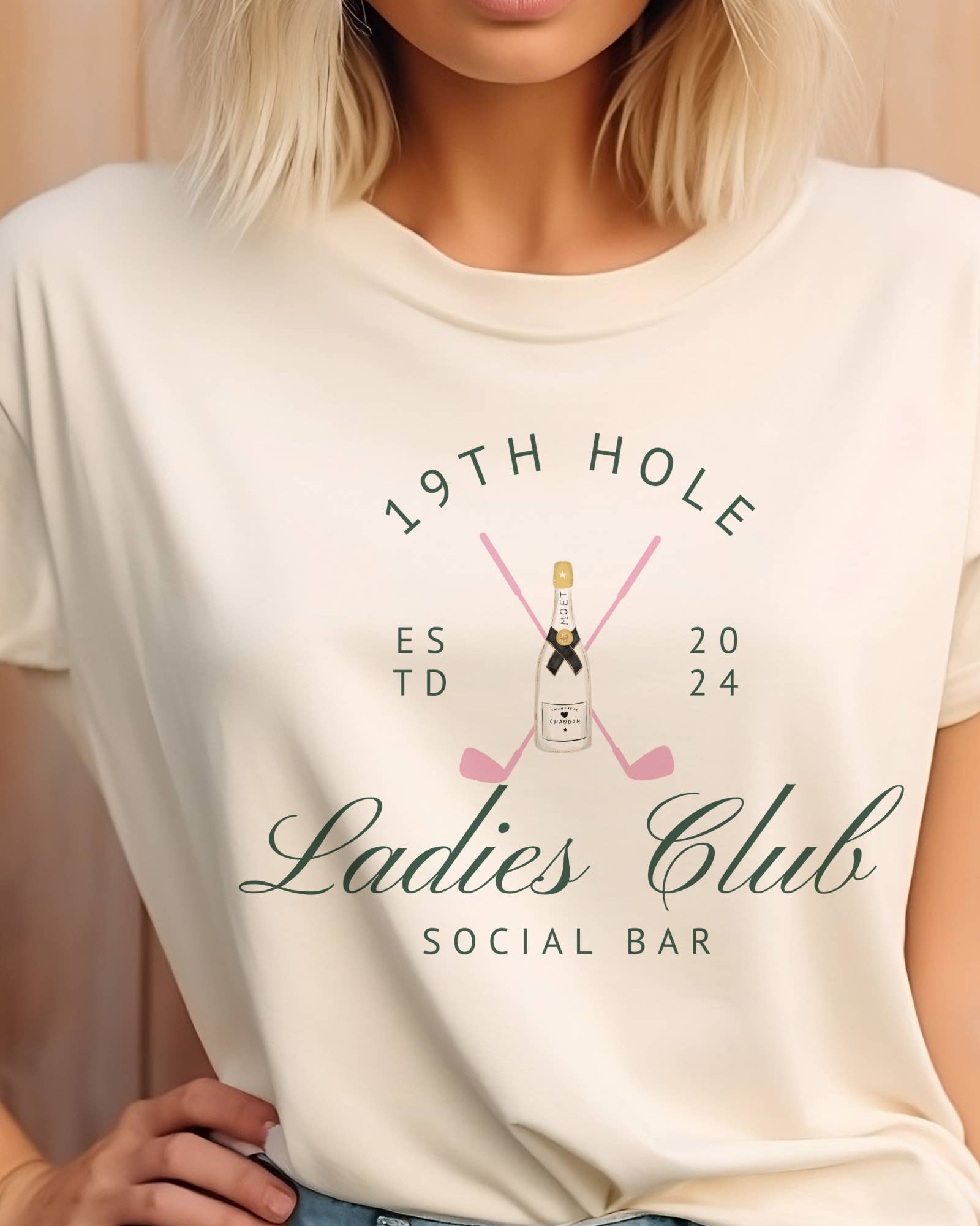  Vanilla tee with 19th hole social bar, pink golf clubs and champagne bottle design for women’s golf lovers. 