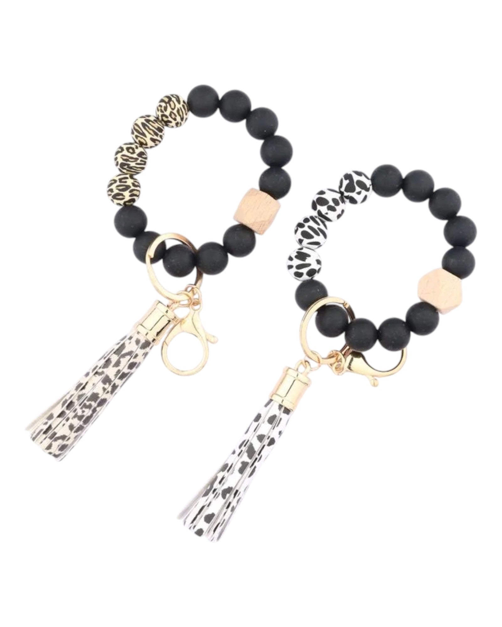 Cow print and animal print silicone bead and leather tassel keychain bracelet.