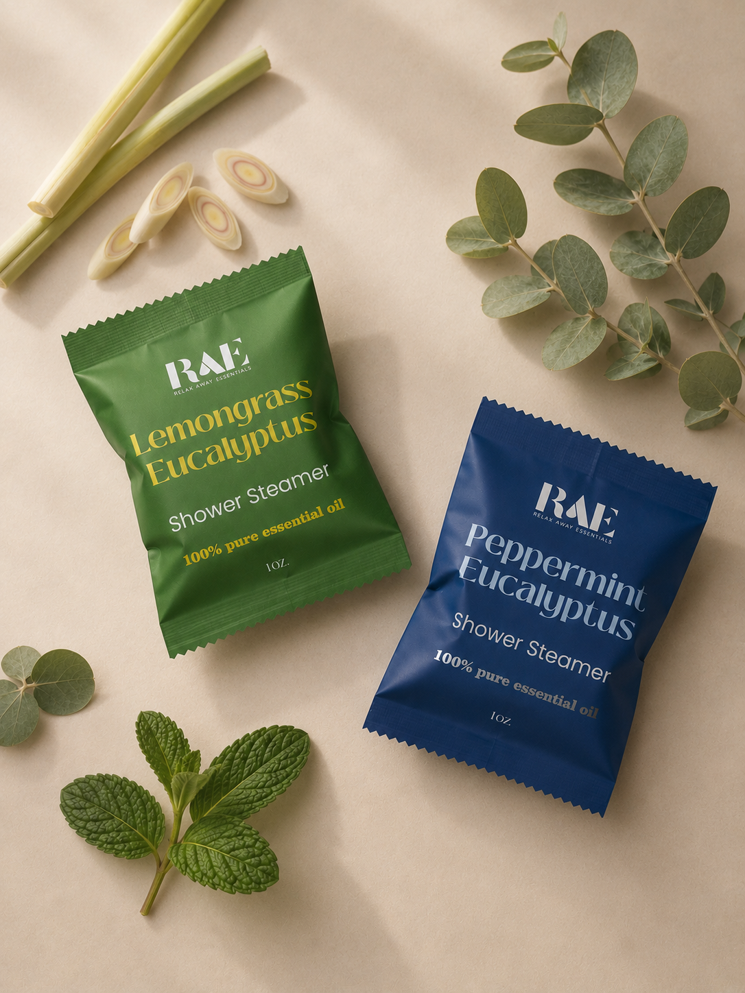 Two shower steamer packets, one green and one blue, with herbs and leaves on a light background.