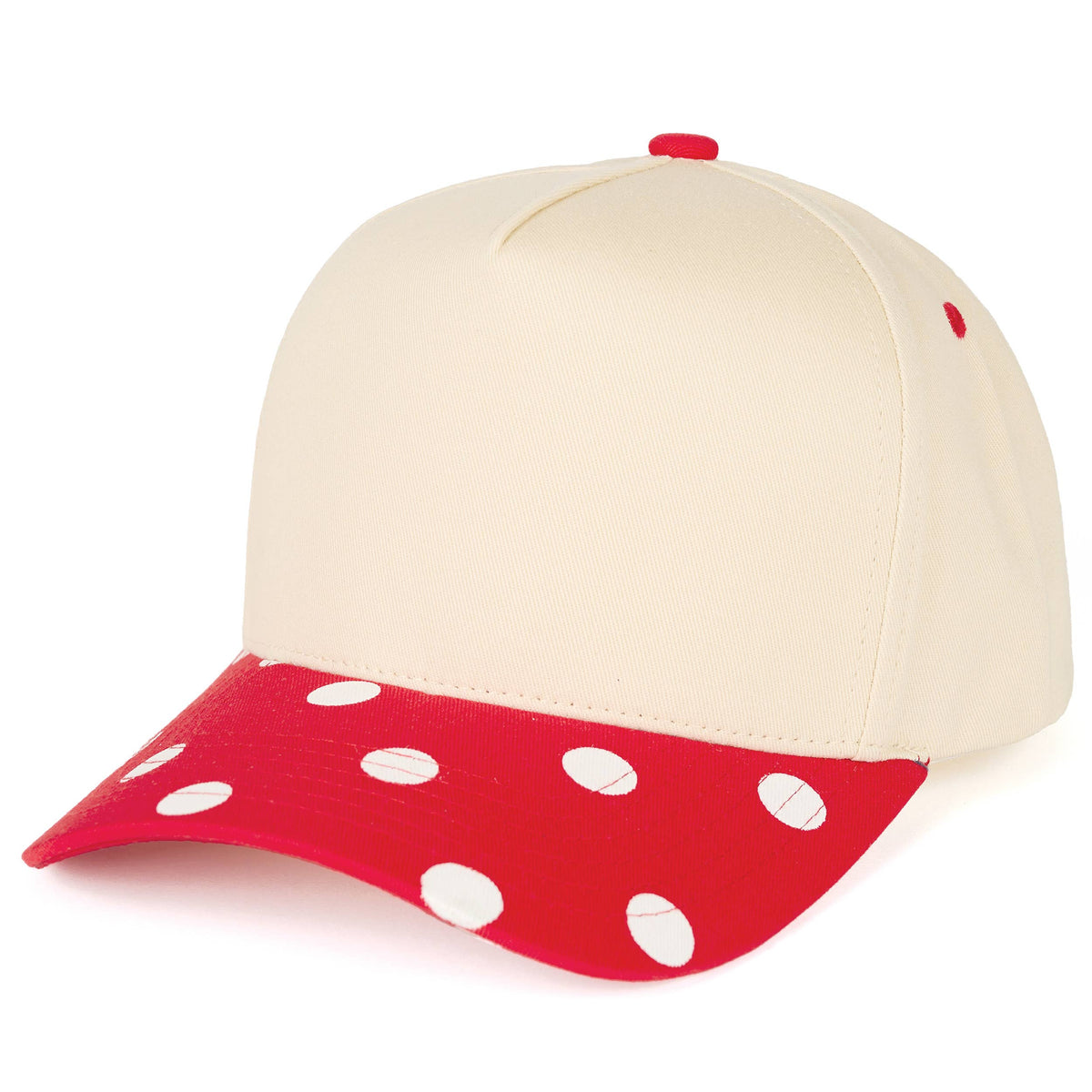 Beige cap with red brim and large white polka dots. 