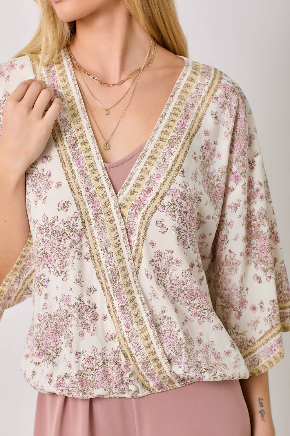 Ivory floral kimono wrap top with 3/4 sleeves and vintage floral print.