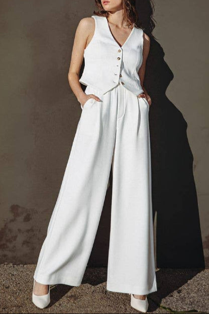 Ivory sleeveless ponti knit vest with V-neckline and button front.