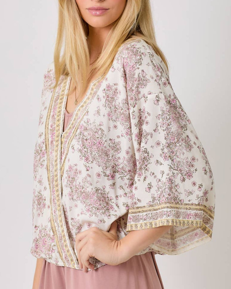 Ivory floral kimono wrap top with 3/4 sleeves and vintage floral print.
