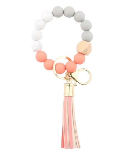 Coral/peach, grey and white silicone and leather tassel boho inspired keychain wristlet / bracelet. 