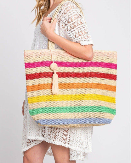Rainbow stripe crochet beach tote bag with tassel and zipper closure.