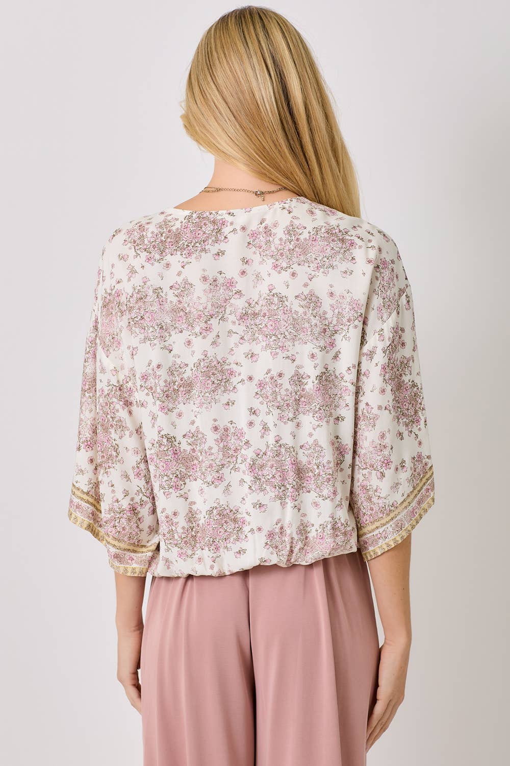 Ivory floral kimono wrap top with 3/4 sleeves and vintage floral print.