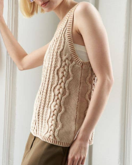 Washed camel colored cable knit tank top with U neckline and sleeveless cut.