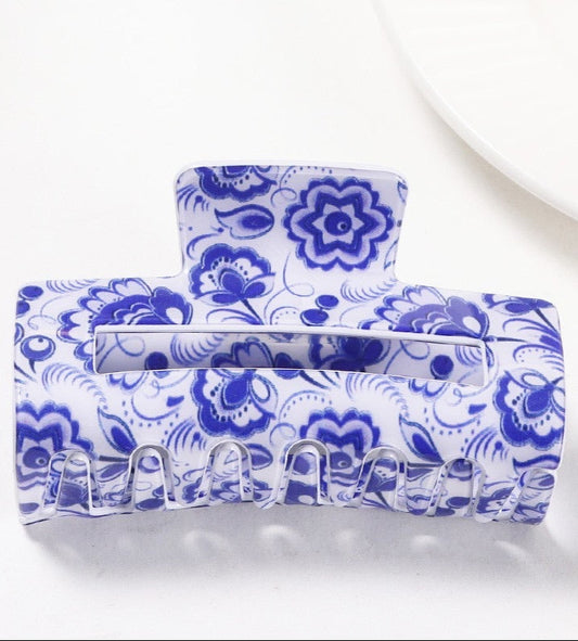 Blue and white Vintage floral patterned rectangle hair clip on a white background.