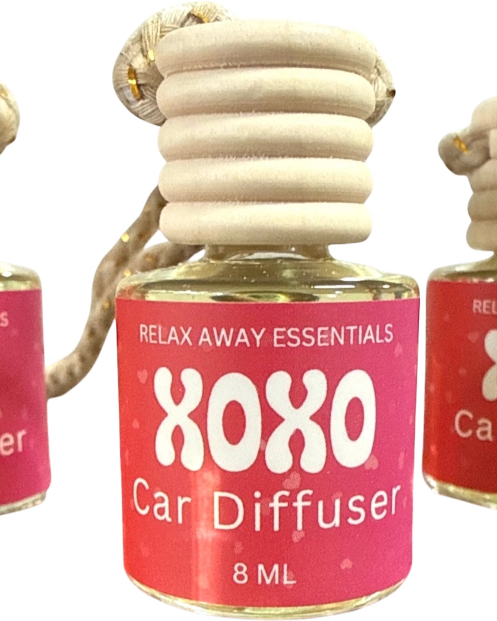 XOXO Car Diffuser with pink label and wooden diffuser on a white background.