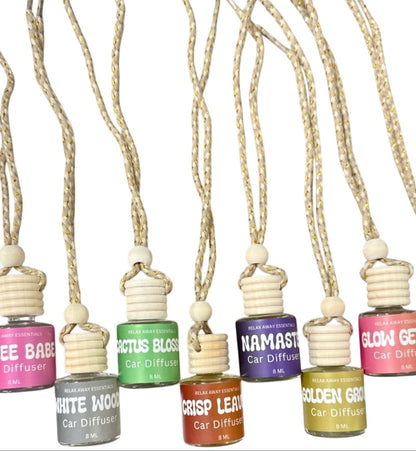 Set of car diffusers with various scents on a white background.