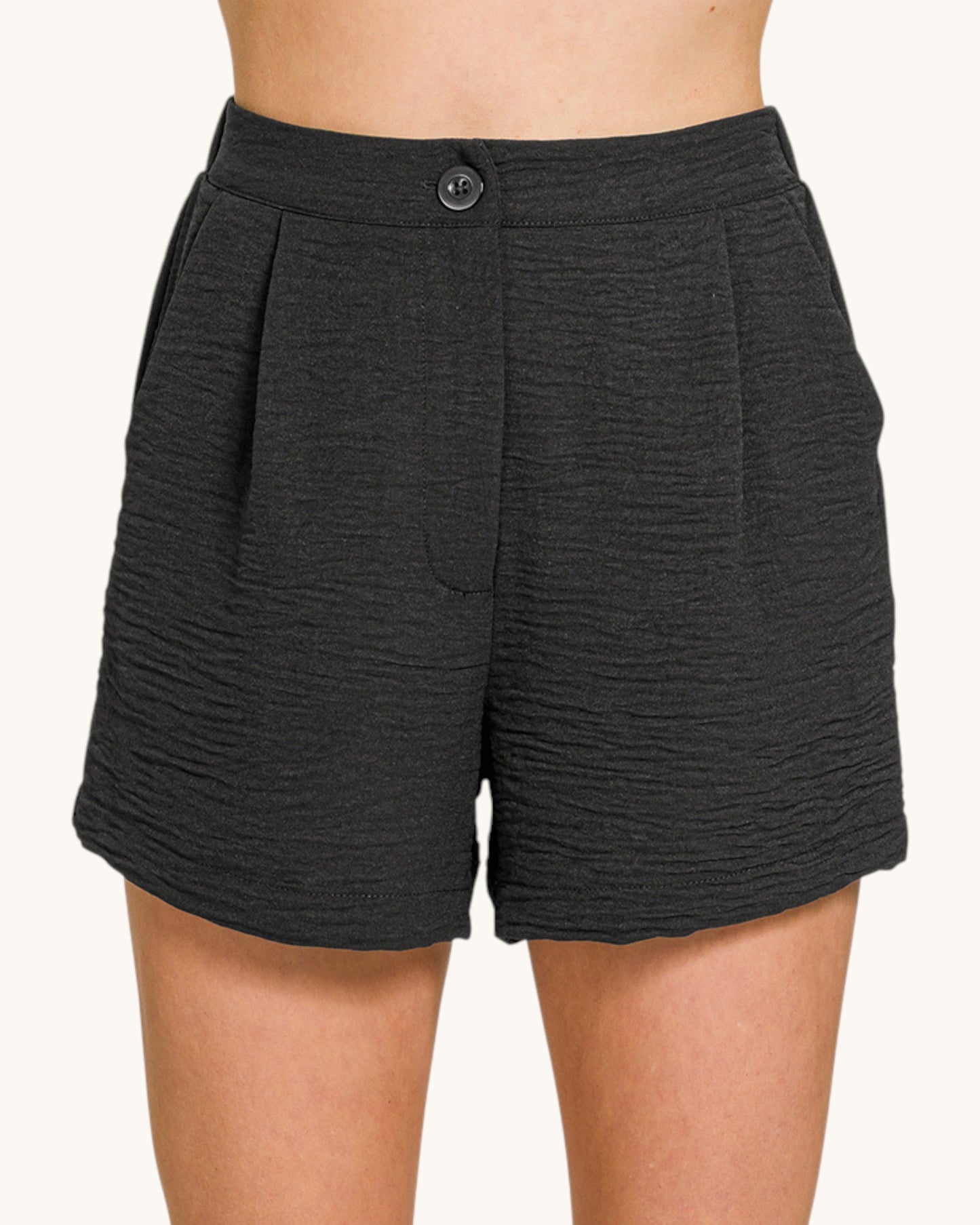 Black airflow woven shorts.