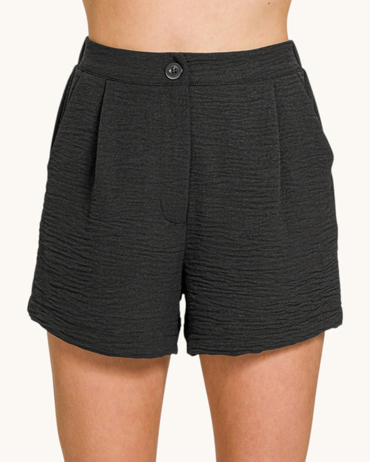 Black airflow woven shorts.
