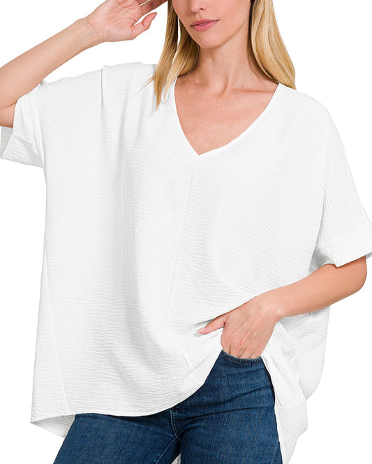 Off white lightweight woven V-neck short sleeve top for women.