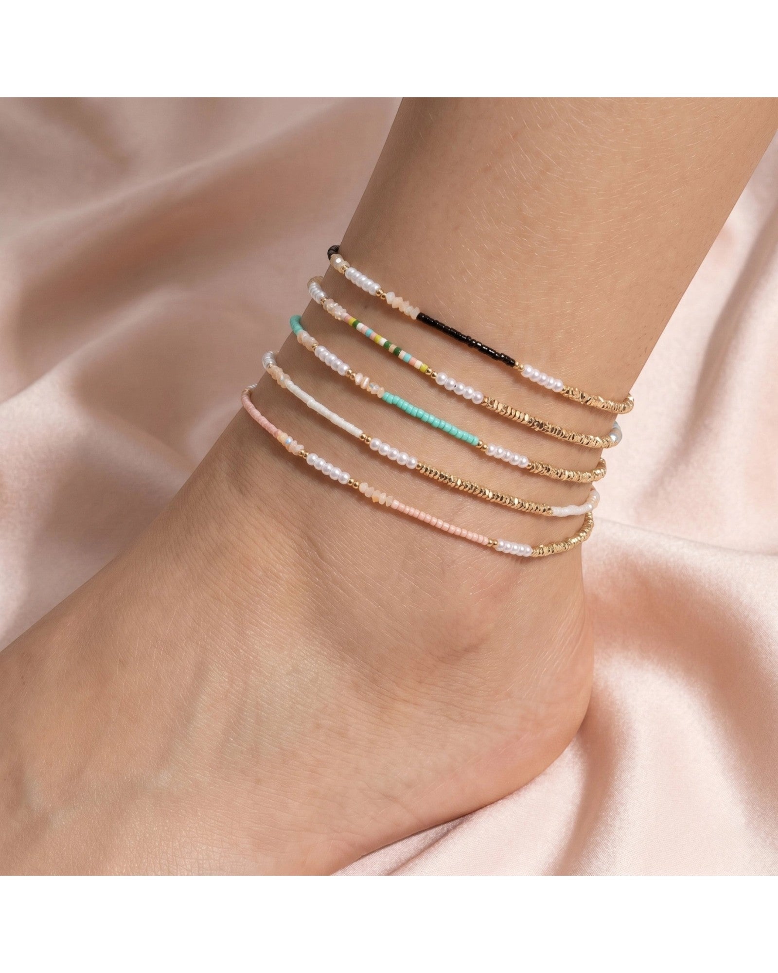 Summer Lovin Glass Bead and Pearl Anklet styled on an ankle showing the full beaded design with pearl and seed bead detail