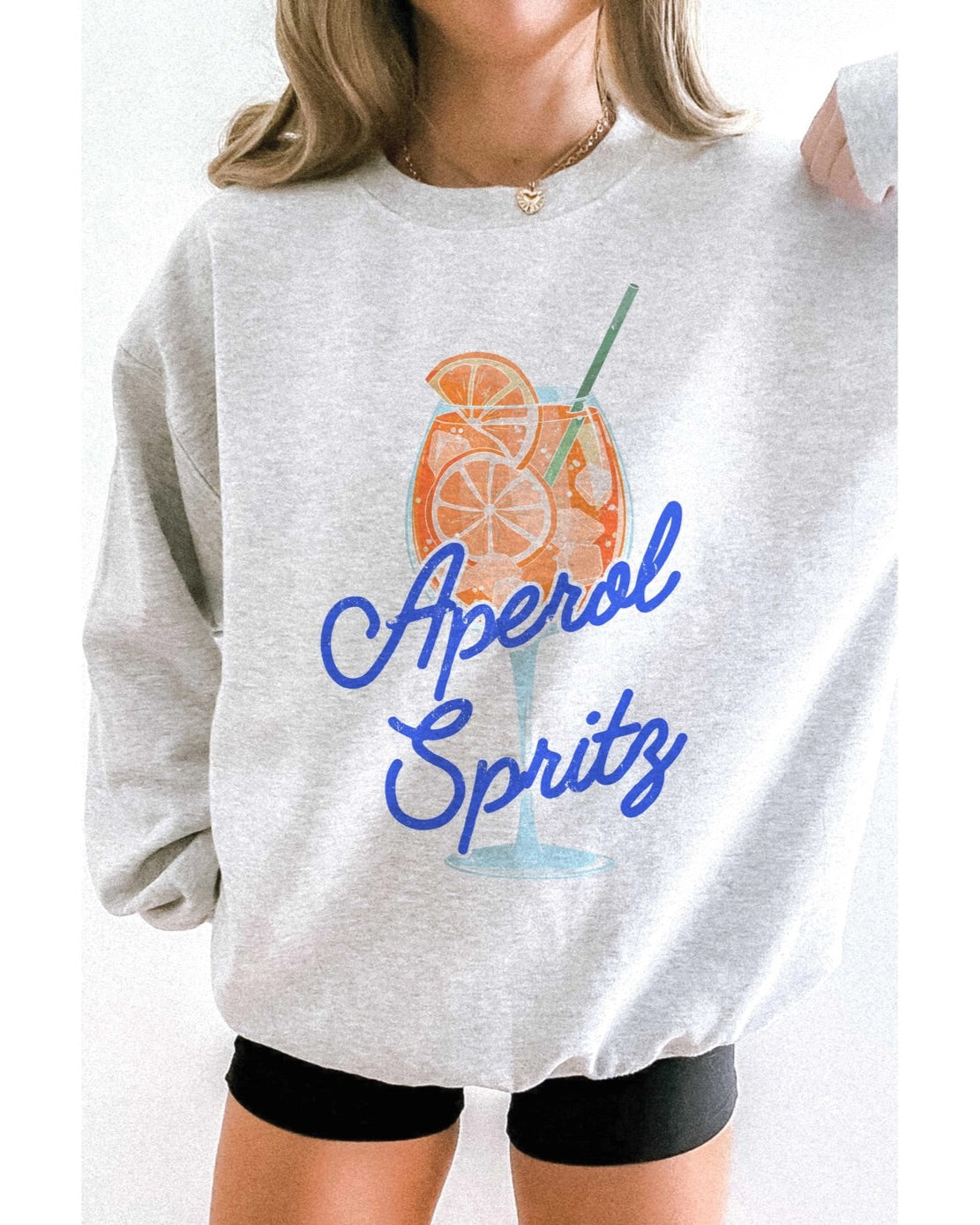 Oversized heather grey sweatshirt with colorful Aperol Spritz graphic.