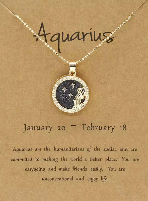 Aquarius zodiac necklace on a brown card with text.