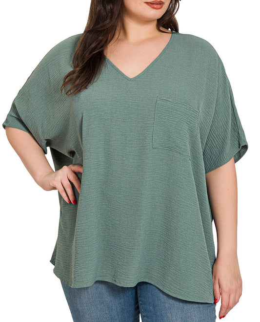 Plus size ash jade V-neck woven top with front pocket and relaxed fit.