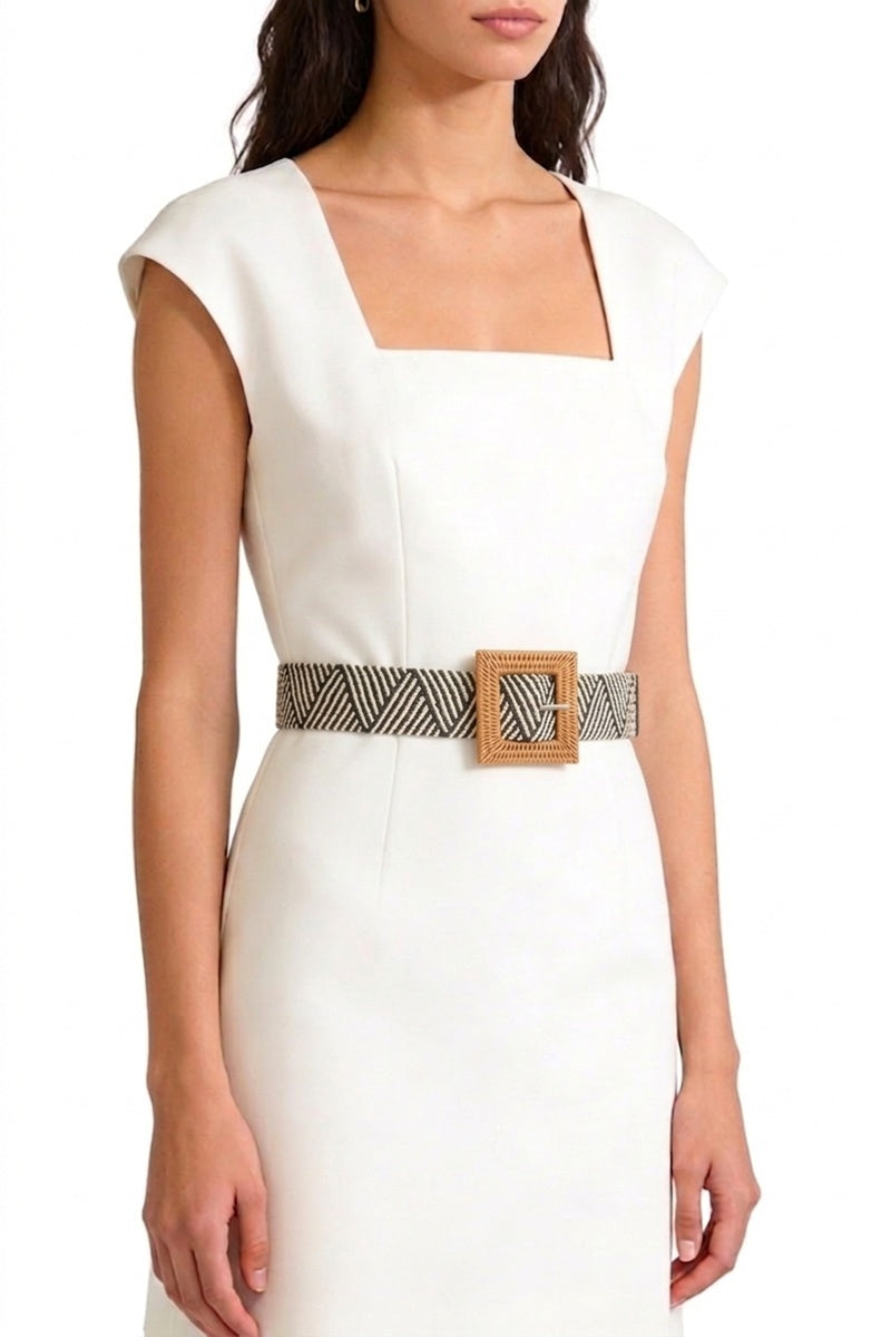 Woman in white dress wearing the black and white Wanderlust Boho Adjustable Buckle Belt.