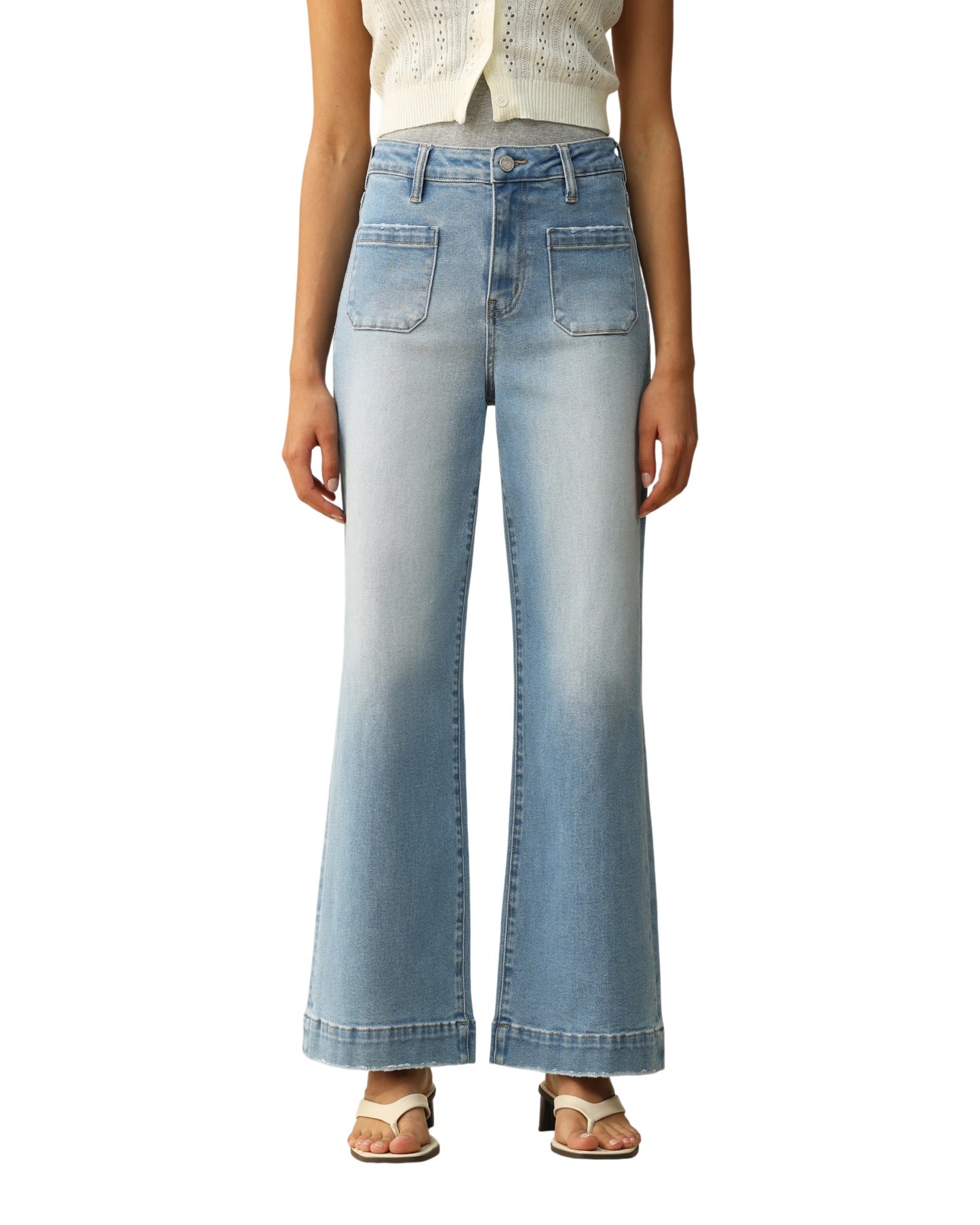 Light blue jeans worn by a person on a white background.