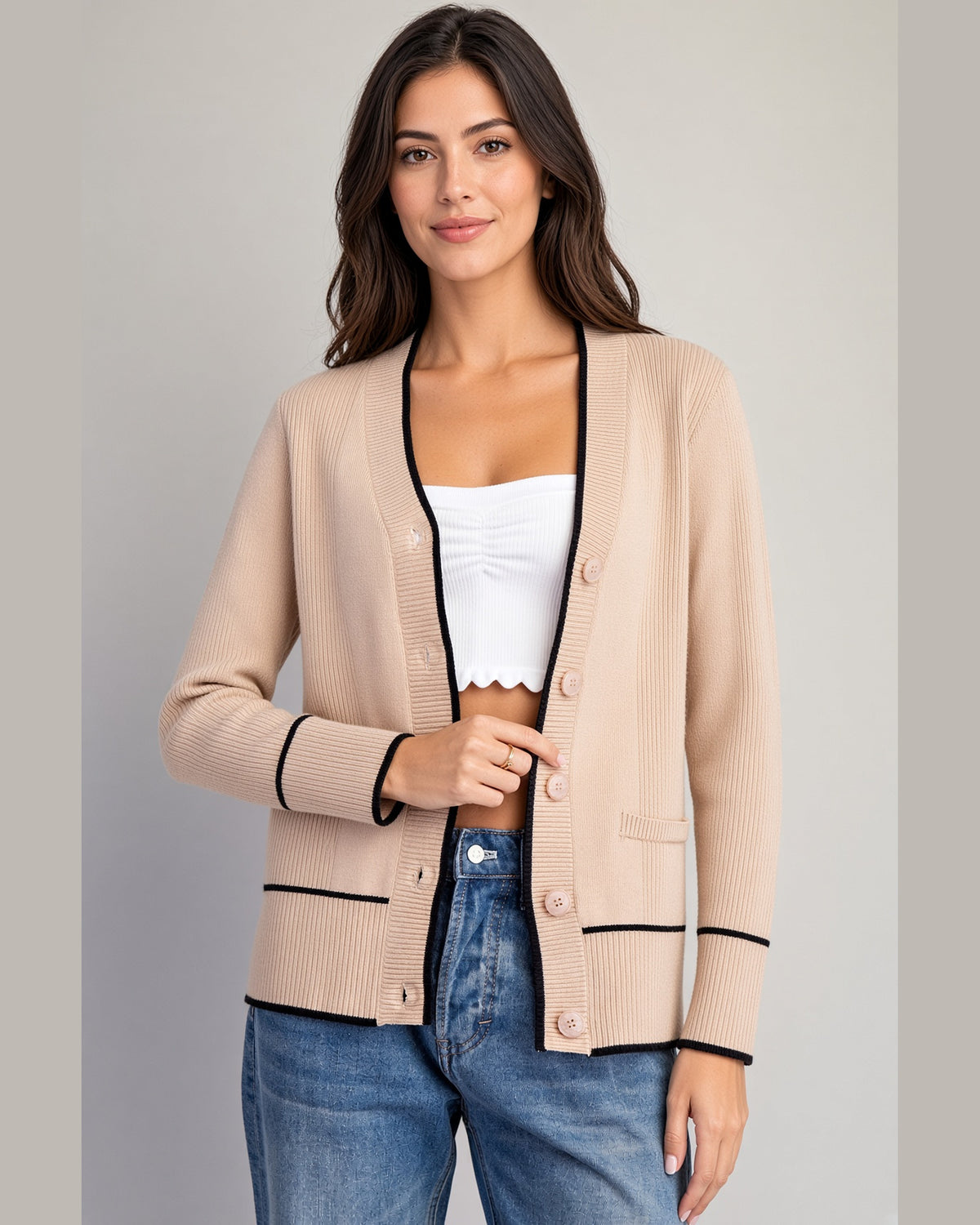 Sand cardigan with black contrast trim, V-neckline, buttons, and front pockets