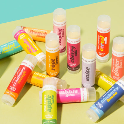 Crazy Rumors Vegan Jumbo Lip Balms in Watermelon Taffy, Banana Split, and Cloud Berry made with organic shea butter and natural flavors. 