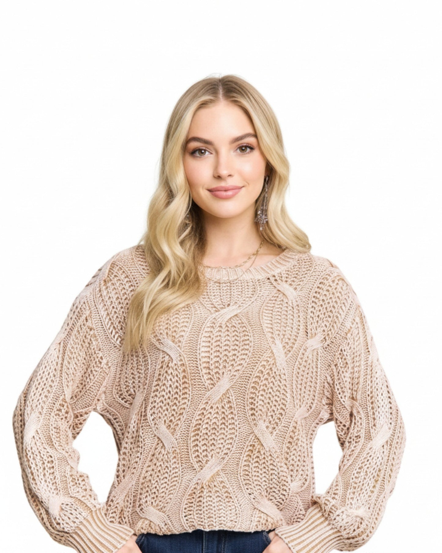Woman wearing a beige knitted sweater on a white background.