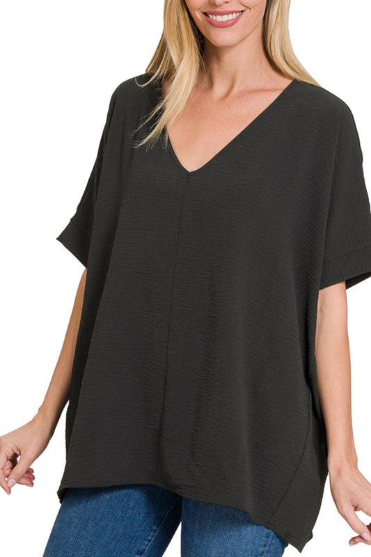 Black lightweight and flowy woven V-neck short sleeve top.