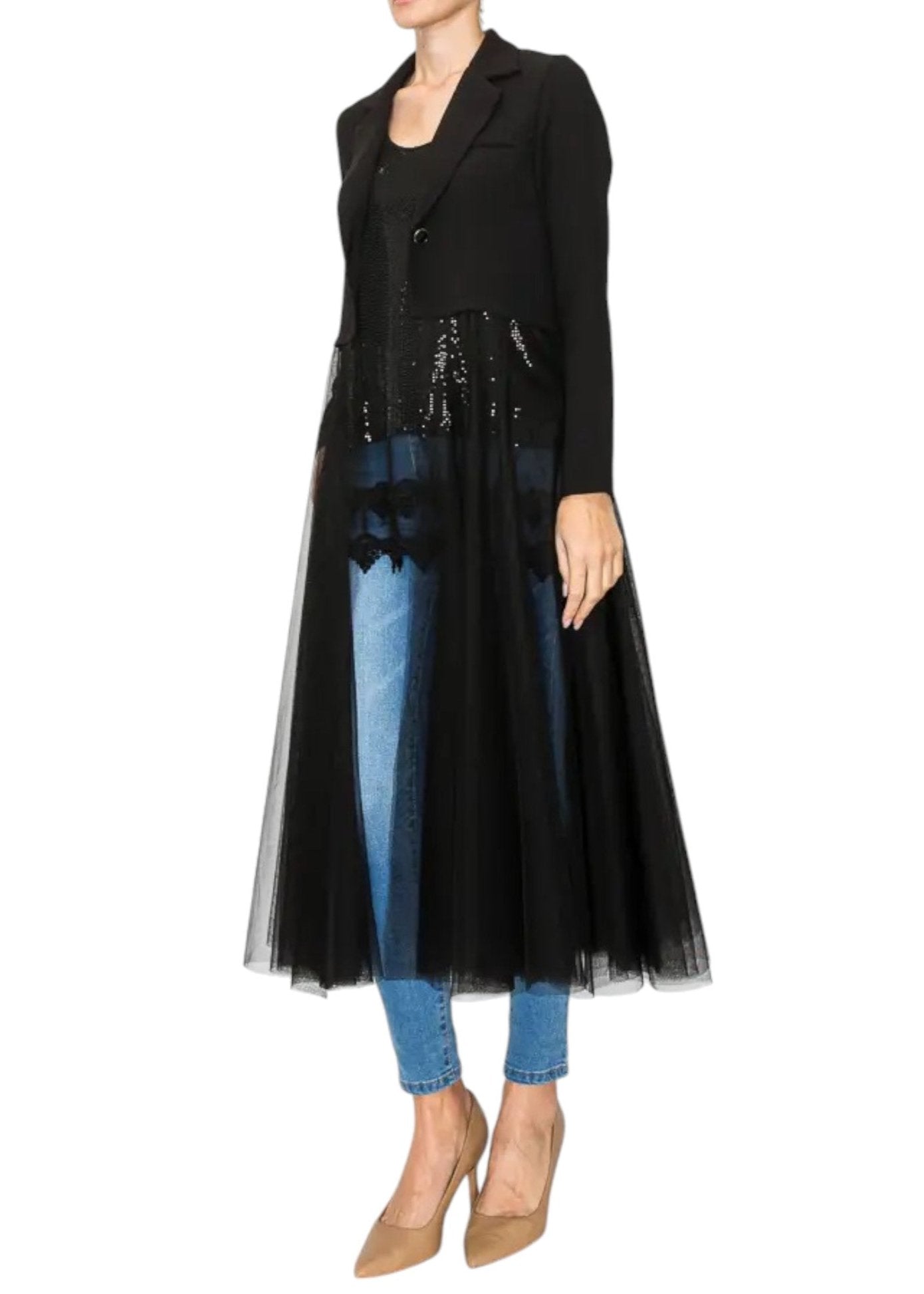 Woman wearing a crop black blazer with long, flowing tulle / mesh duster.