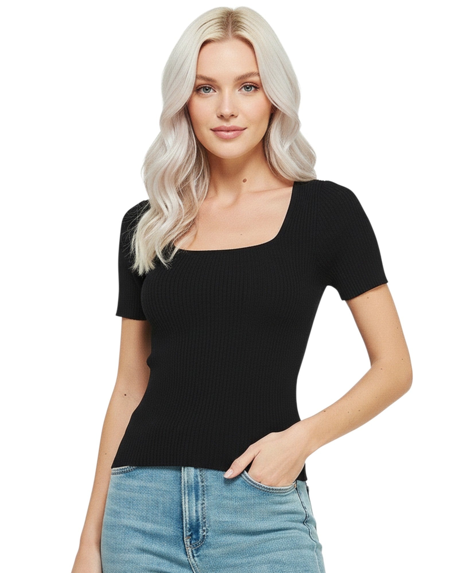 Woman wearing a black ribbed top and blue jeans on a white background.