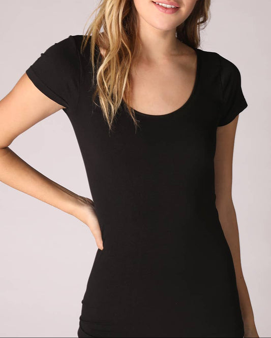 Woman wearing a black seamless scoop neck short sleeve shirt against a plain background.