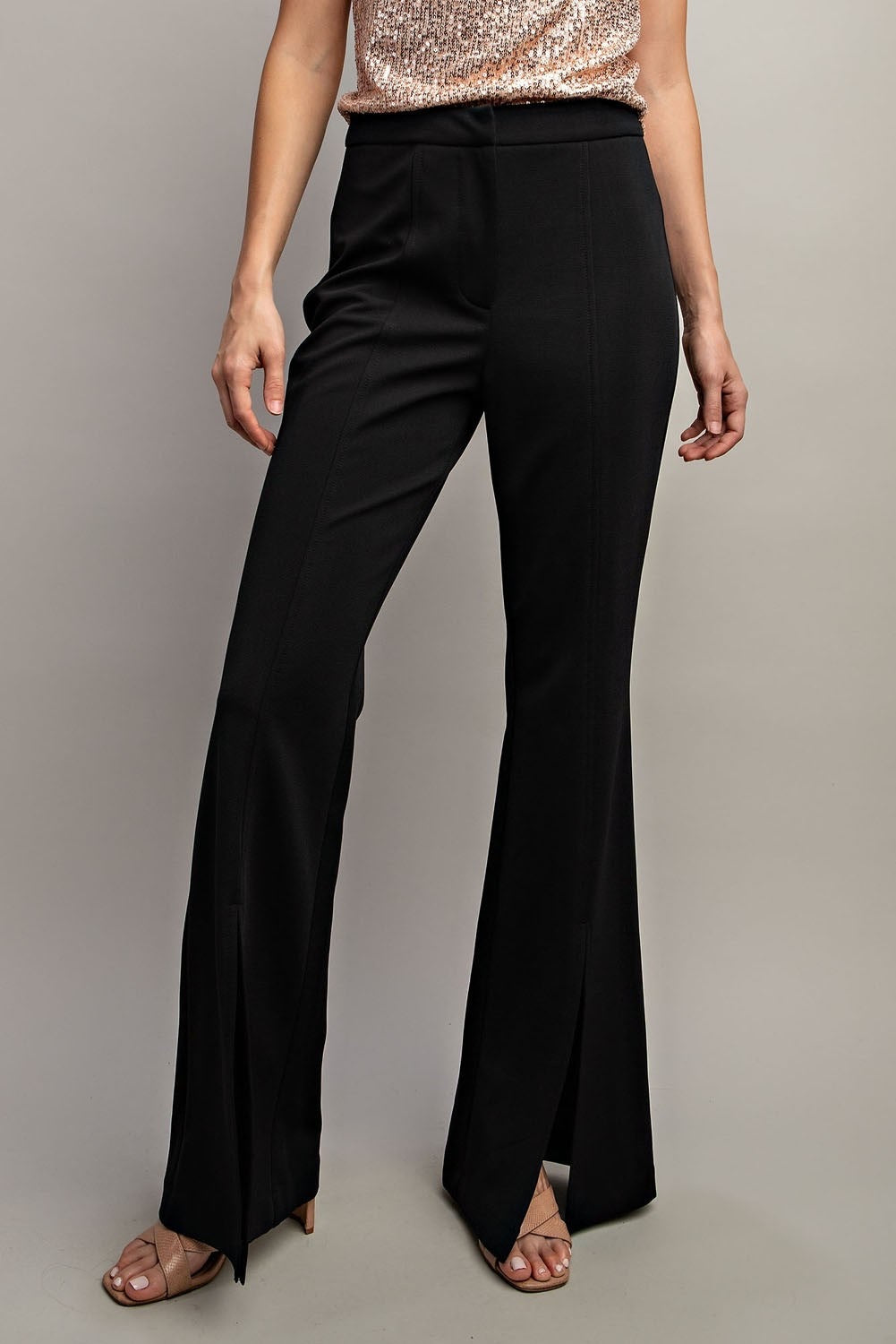 Black wide-leg pants worn by a person on a neutral background.