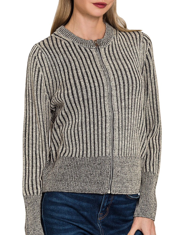 Woman wearing a charcoal heathered ribbed zip up sweater cardigan with a white background.