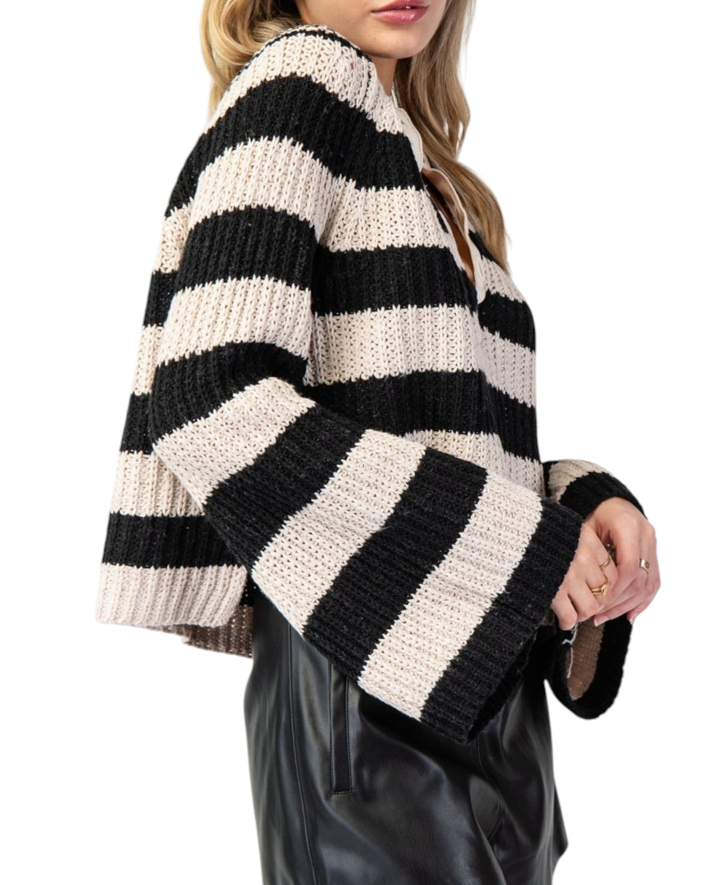 Black & Tan Striped Bell Sleeve Sweater with bold stripes, notched neckline, and a slightly cropped fit featuring side slits and flowy bell sleeves.