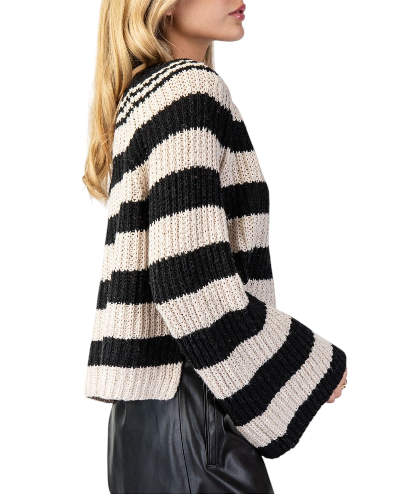 Black & Tan Striped Bell Sleeve Sweater with bold stripes, notched neckline, and a slightly cropped fit featuring side slits and flowy bell sleeves.