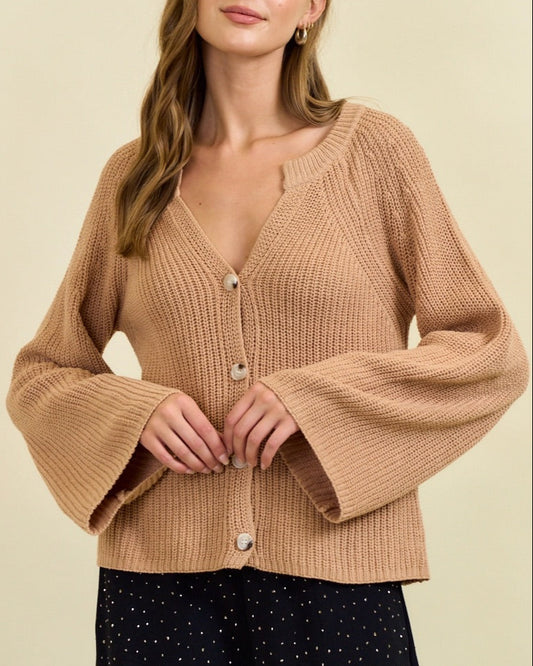 Tan ribbed button cardigan with blouson sleeves and gold buttons.