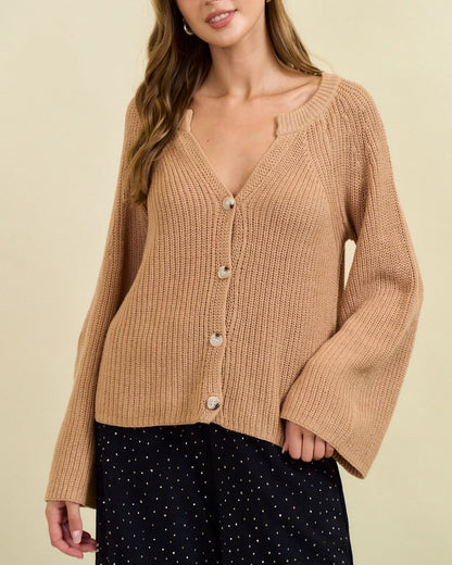 Tan ribbed button cardigan with blouson sleeves and gold buttons. 