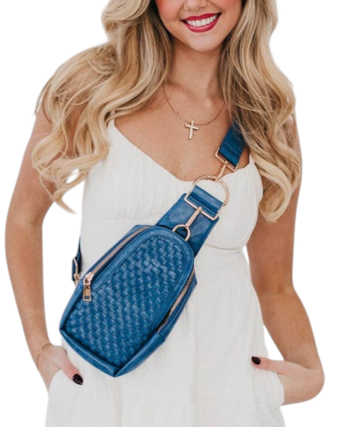 Woman wearing a blue woven crossbody bag on a white background.