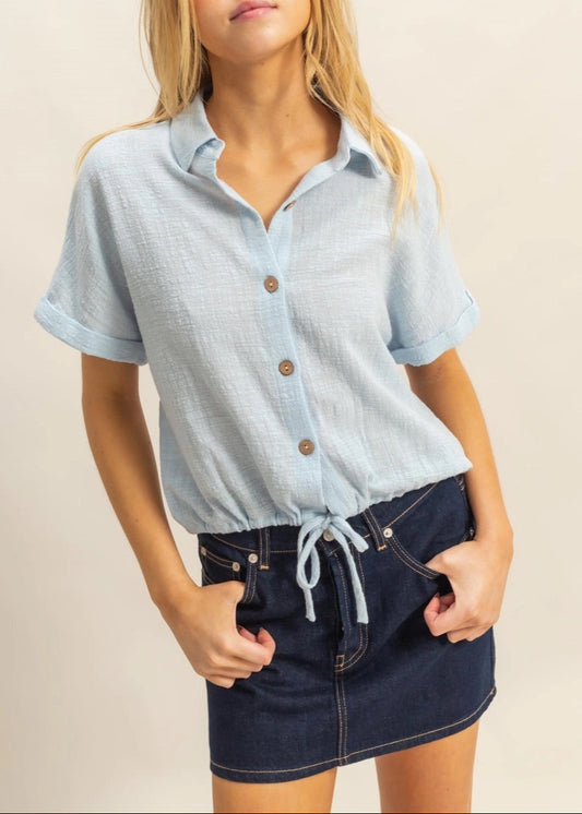 Sky Blue short sleeve 100% cotton button-up shirt with drawstring hem.