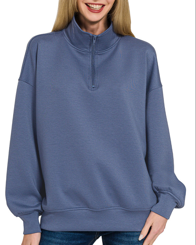 Woman wearing a Blue Indigo half-zip scuba pullover with relaxed fit and soft stretch fabric.