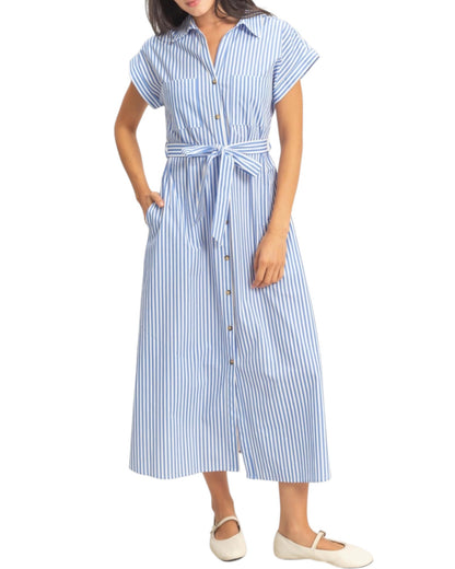 Woman wearing a blue and white striped shirt dress on a white background.