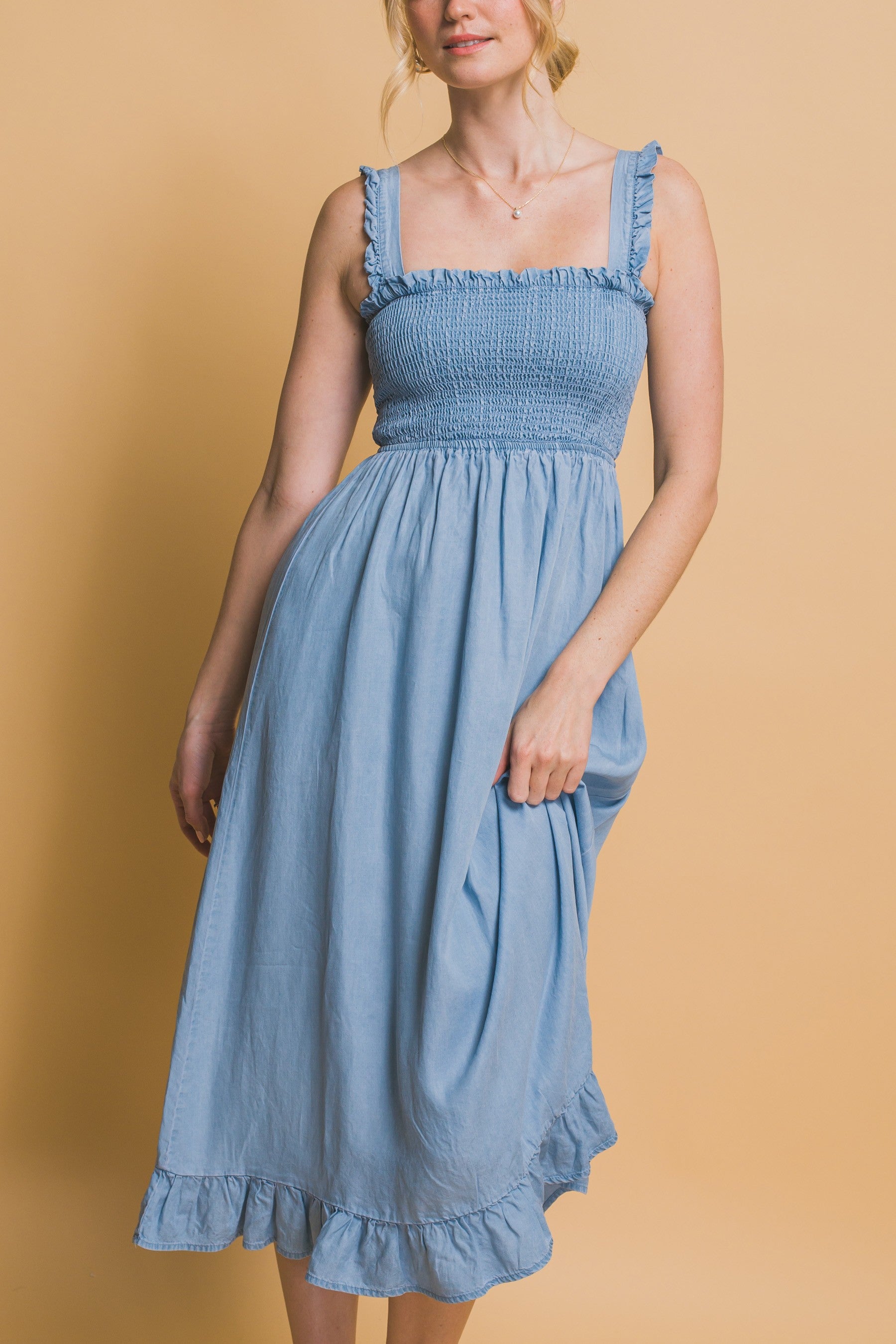 Light blue maxi dress with smocked waist, flounce hem, and ruffle straps in airy Tencel fabric.