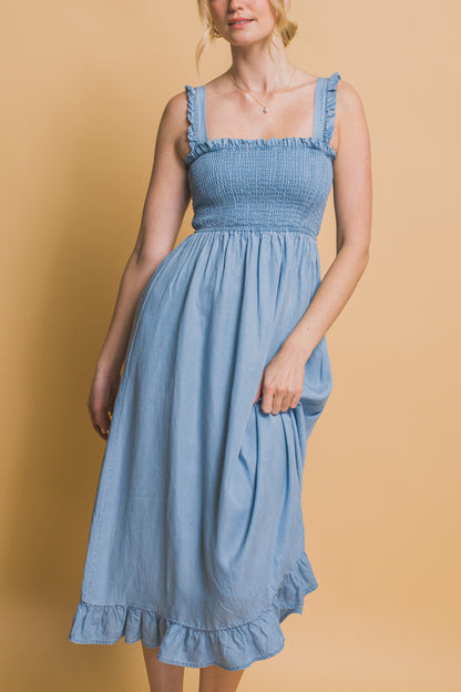 Light blue maxi dress with smocked waist, flounce hem, and ruffle straps in airy Tencel fabric.
