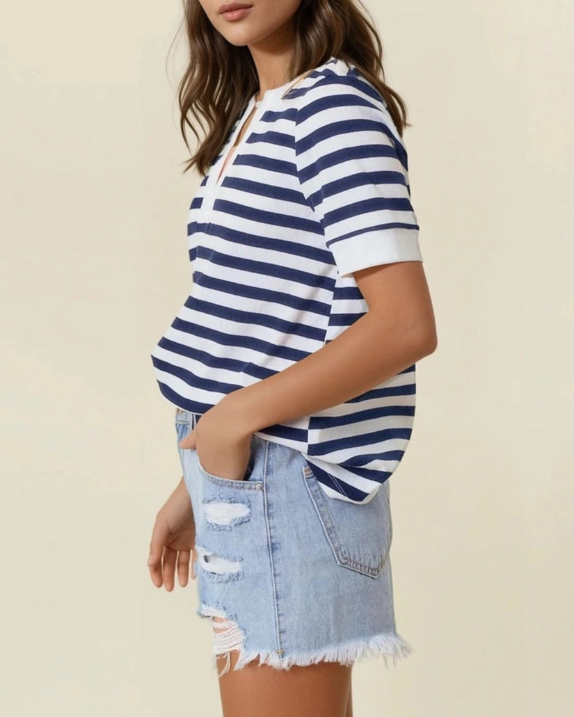 Navy and white striped knit V-neck short sleeve top with white trim. 