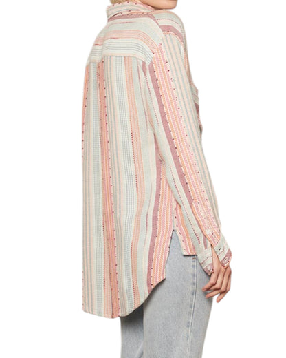 Striped long-sleeve shirt worn by a person on a white background