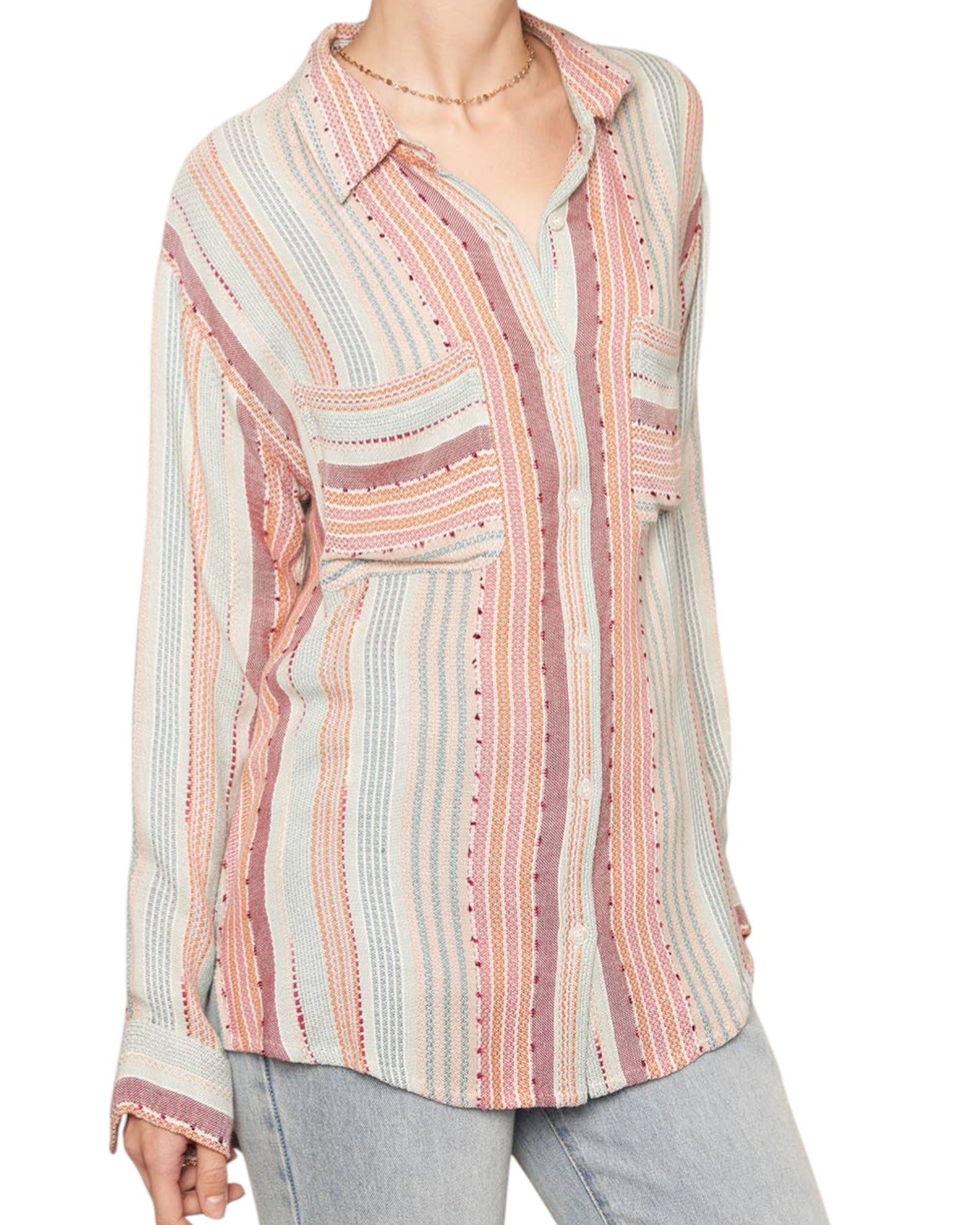 Multicolored striped shirt worn by a person on a white background