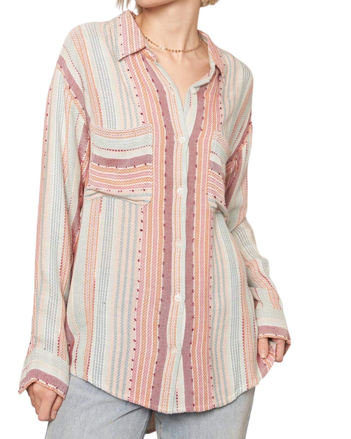 Multicolored striped shirt worn by a person on a white background