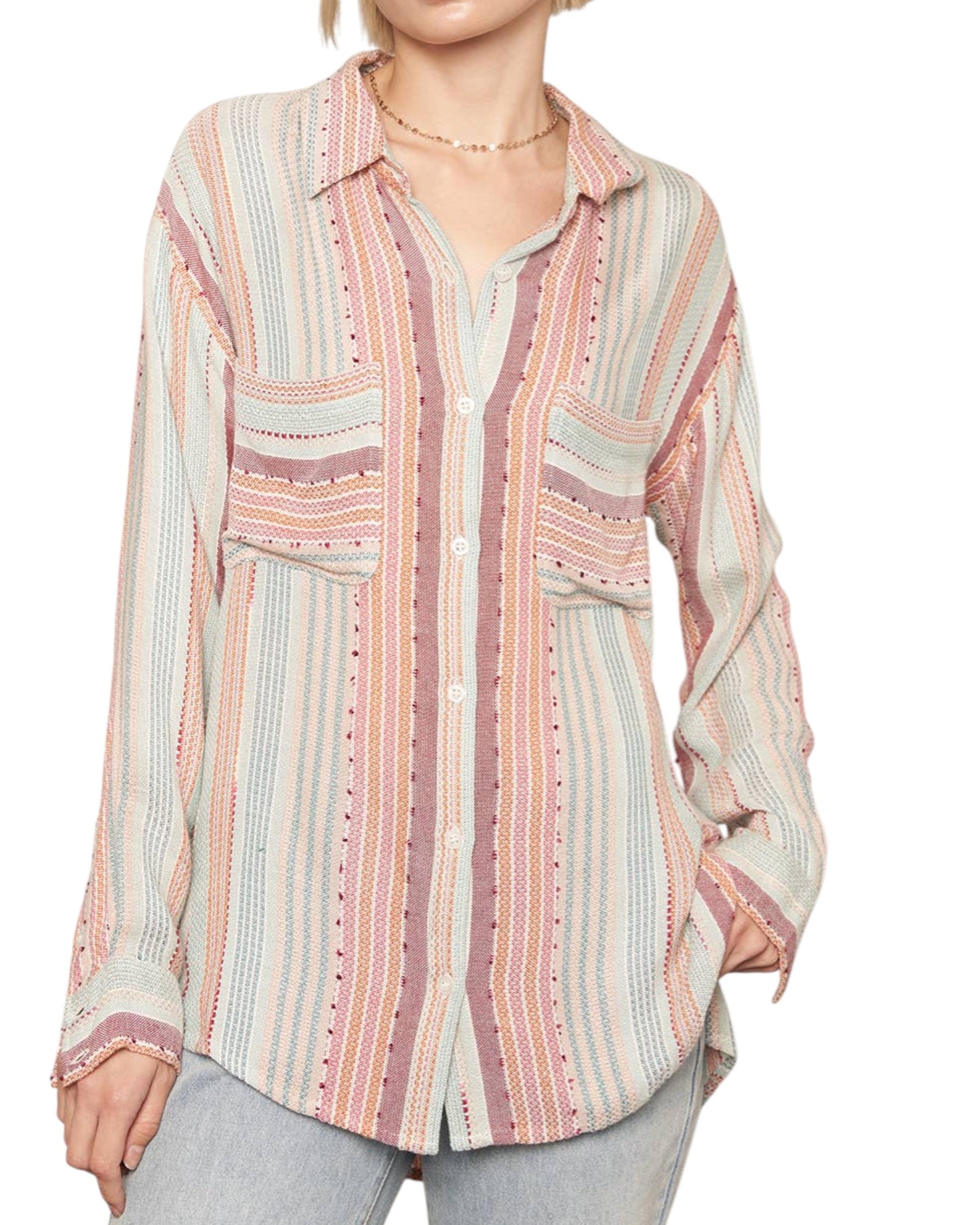 Multicolored striped shirt worn by a person on a white background