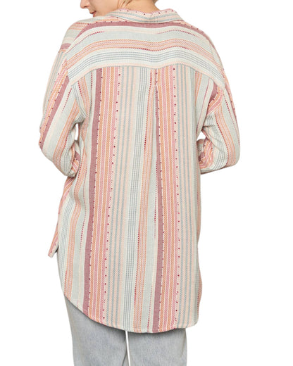 Person wearing a striped shirt with a white background