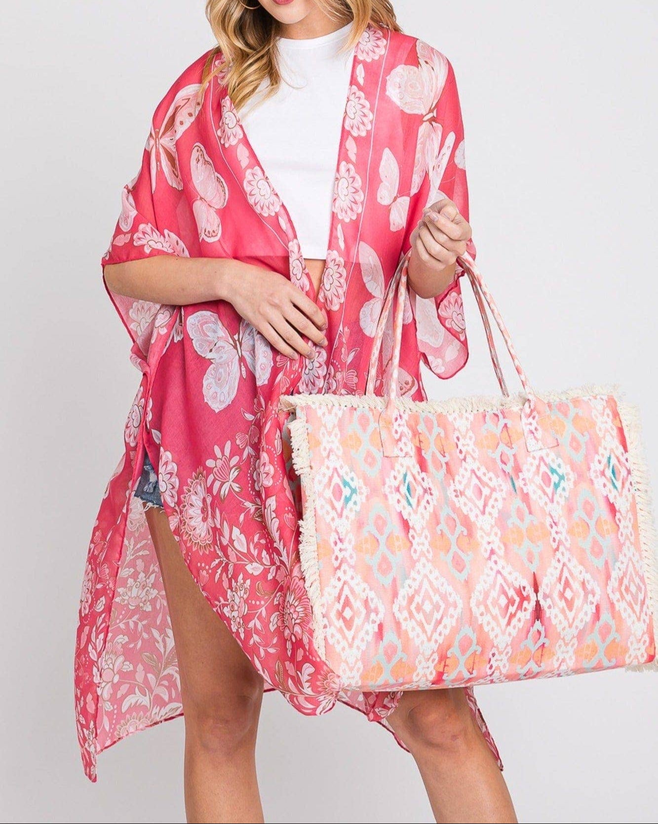 Coral and pink fringe boho beach tote with snap closure and soft fabric. 